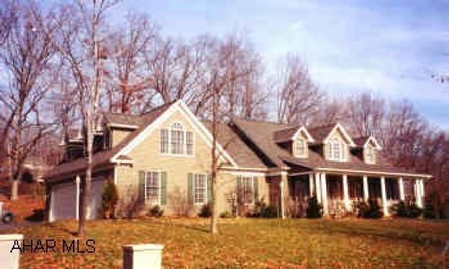 EXQUISITE CONTEMPORARY CAPE COD, OPEN LIVING AREA ACCENTED WITH GRAND PILLARS AND STONE FIREPLACE, 2 STAIRCASES, UPGRADED APPLIANCES.  UNIQUE AND BEAUTIFUL 4 BEDROOM HOME ON LARGE CORNER LOT.  DRAMATIC FLOOR PLAN ALLOWS FOR GRACIOUS, EFFICIENT AND PRIVATE LIVING.  2ND STAIRWAY LEADS TO SUITE FEATURING LARGE BATH AND WALK-IN CLOSETS.