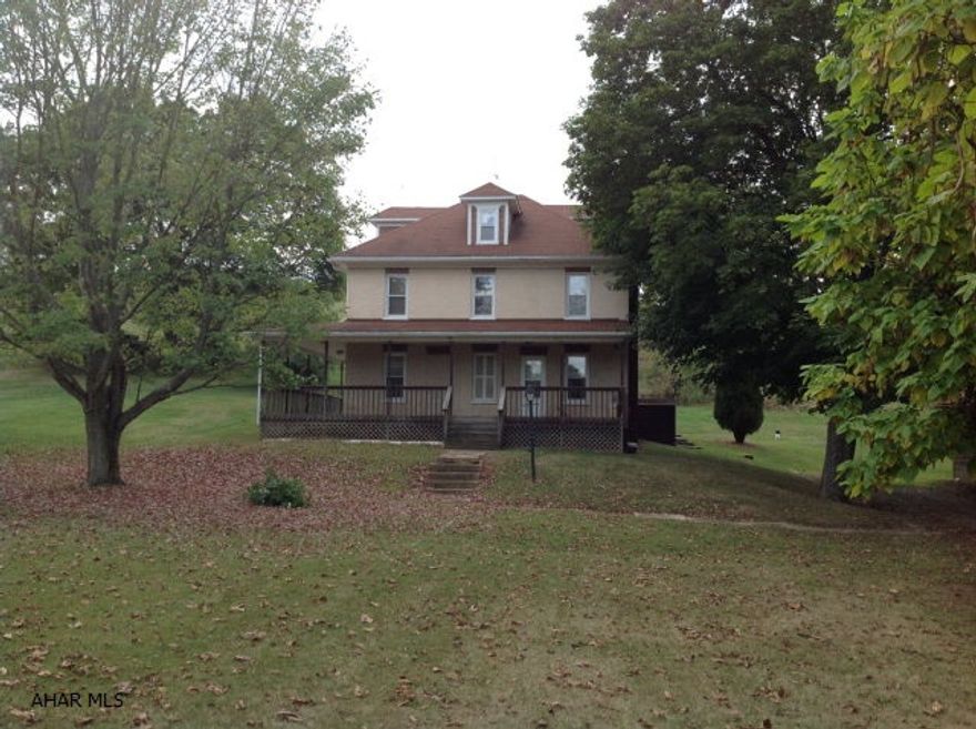 2 story brick home, 3 bedrooms 1.5 bath with updated thermo pane windows, oak kitchen cabinets, a wood burning stone fireplace. Covered back patio, garden potential, and a new wrap around front porch.  Spacious 3 car garage and work area.  Large yard and only minutes from town.