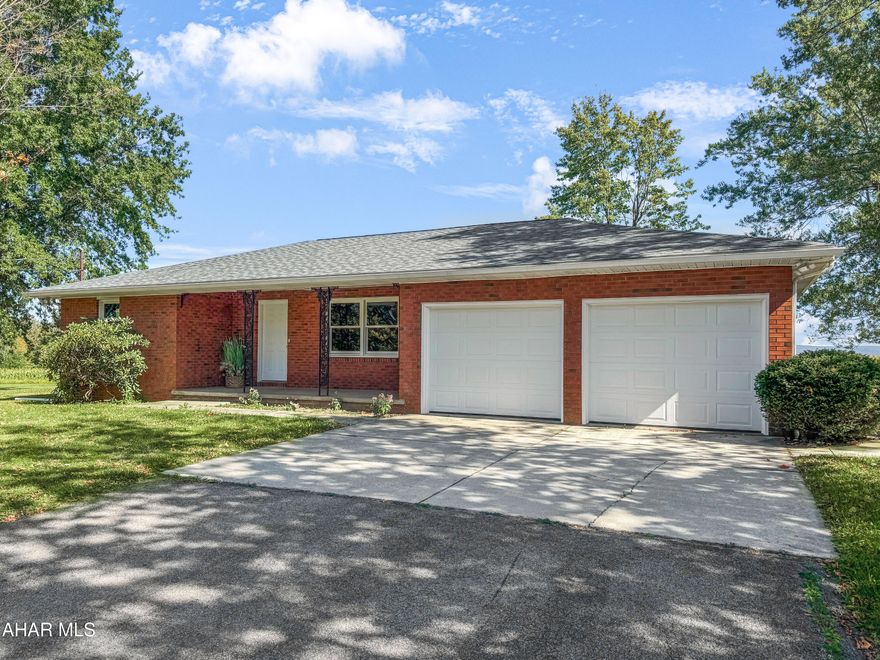 Welcome to 767 Manor Drive, a stunning all-brick ranch home in the Central Cambria School District, offering the perfect blend of privacy, breathtaking views, & modern updates on approximately 1.70 acres of pristine land. Recently enhanced w/ a new roof, windows, furnace, hot water tank, septic system, & LeafGuard gutters, this impeccably maintained residence invites you into a spacious living room w/ gleaming hardwood floors, a beautifully appointed kitchen w/ floor-to-ceiling cabinetry, & a charming dining area ideal for entertaining. The main level also boasts two generous bedrooms & a tastefully renovated full bath, while the expansive unfinished basement offers endless possibilities for customization. Outside, enjoy an attached two-car garage, a rear concrete patio, a covered front porch for relaxing evenings, & a sprawling, level yard that elevates this property's serene appeal. Call today!