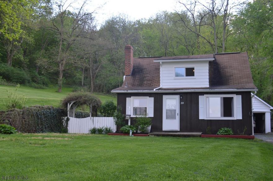 This beautifully updated home within Hollidaysburg is set back off the road offering extreme privacy and has over one acre of ground.  The kitchen and bath have been recently updated. 3 bedroom, 1.5 bath and 1 car garage. Finished basement with tons of potential.