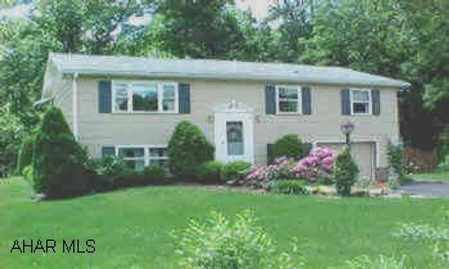 This great bilevel is inviting from the moment you step inside the front door. Hardwood floor in the dining area and hardwood under carpet in the living room, hallway, and bedrooms. A screened in patio off the dining area, nice private backyard. One car garage was converted into a workshop/paint studio. Can easily be coverted back by removing one wall. Garage door still in place.