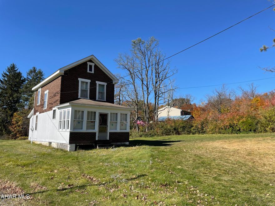 This uniquely shaped 2 acre parcel has a 2 story home according to courthouse records with no documented date of construction but believe it was before 1900 and has recently had several major updates such as newer furnace in 2020 and electrical system in 2022.  The home also has public water and sewer. Current owner insulated the sunroom, has moved laundry to the first floor, and has installed new front door and bathroom sink.  Call today to see this one of a kind property.  Motivated seller.