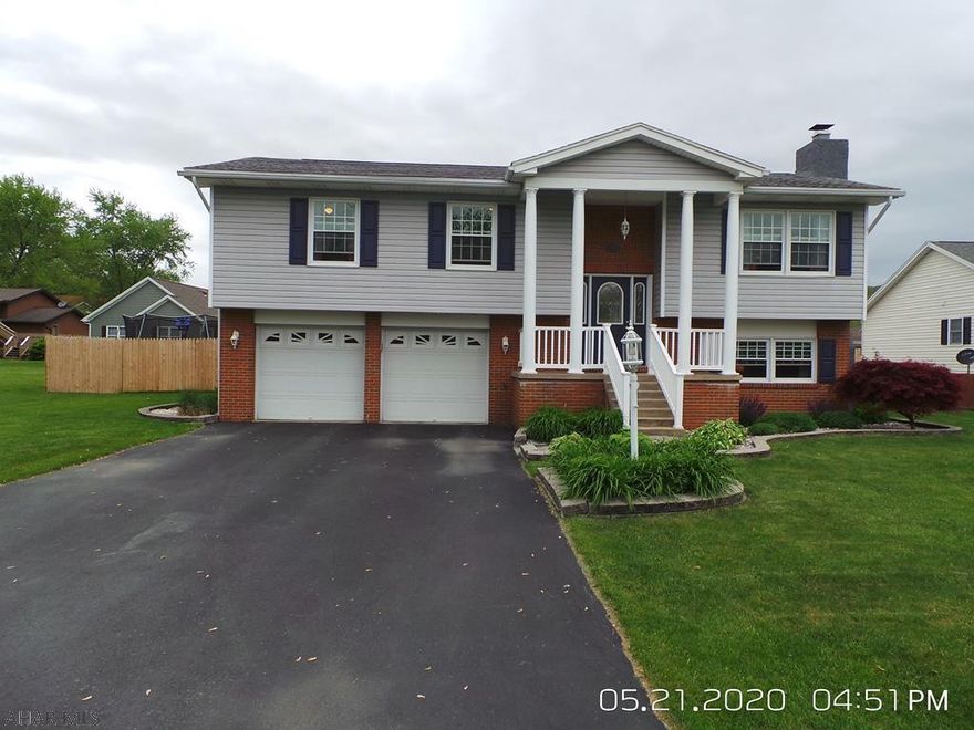 Located in Old Towne Village development on a nice fenced flat lot w/large deck, patio, and fire pit - this 3 bedroom - 2.5 bath home is ready for you.  Recently painted, all bathrooms updated w/vanity, toilet, mirror and flooring, most light fixtures replaced, kitchen w/new sink, fridge & microwave and the lower level FR w/newer carpeting and wood fireplace.  30 AMP outlet outside for your RV.  This home has so much to offer.