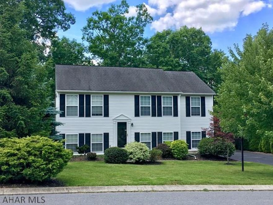 You are home! Lovely 4 bdrm, 2 bath home situated on .68 ac lot which backs to woods. Hardwood floors, update lighting, central air, natural gas, one year home warranty. Close to Reservoir Park. Just 30 minutes to State College.