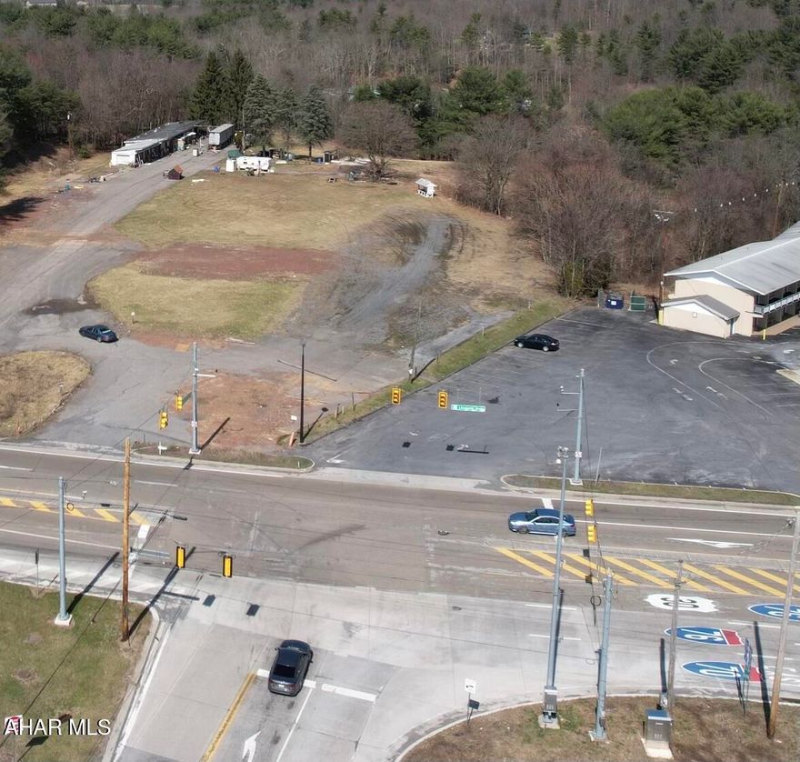 Prime commercial location in the heart of Breezewood, PA!! Located just off the PA Turnpike Interchange and Interstate 70, this property offers 5.81 acres with excellent visibility and exposure for any business. Public sewer, drilled well, and electric on site. Great site for a restaurant, hotel, convenience store, retail business, apartment complex, warehouse, service garage, or other businesses. Very easy access to major roads, no zoning, level site, and State Route 30 road frontage make this an ideal commercial lot ready for new development.