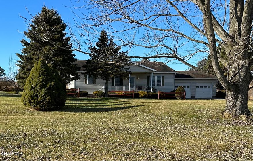 This spacious move in ready ranch home on .6 +/- acres is conveniently located between the Bedford Interchange and the Cessna Exit off of I99.  The front deck offers lovely views of the countryside while the home's spacious design offers plenty of room for family entertainment and enjoyment.  The master bedroom has an en-suite bathroom while two additional bedrooms share another bathroom.  Enjoy the abundance of cabinet and counter space in the large kitchen which opens onto the bright and airy dining area. A laundry/ mud room is conveniently located next to the kitchen and back entrance of this home.  The oversized attached 2 car garage allows easy access to the kitchen and provides ample storage and a work bench.