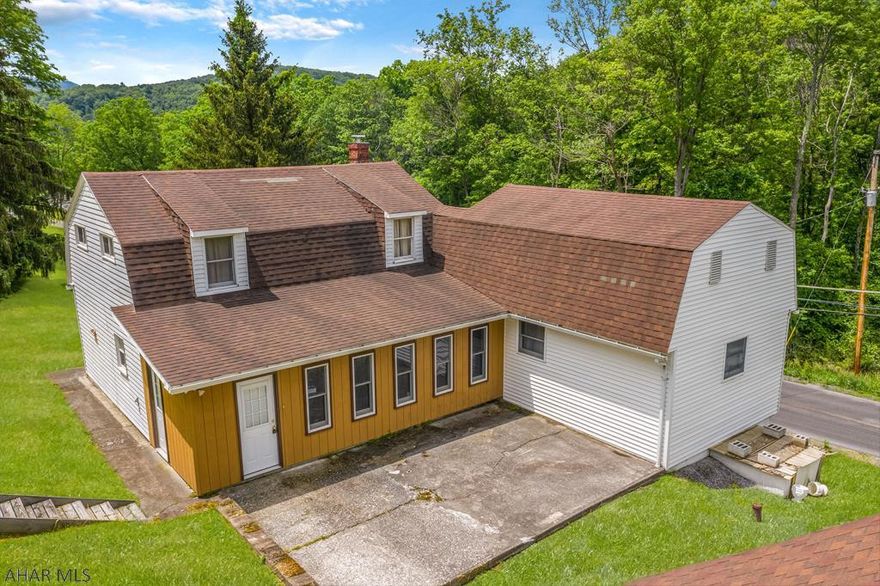 Don't miss this 3 bedroom home situated on 2.39 acres in a country setting in the Hollidaysburg School District. First floor features a large eat-in kitchen with solid wood cabinets, half bath, living room, large closed in porch previously used as home office, bonus room previously used as a 2nd home office and a family room that could be used as a 4th (master) bedroom. Second floor has 3 nice size bedrooms and full bath.  Partially wooded lot with detached garage. Check out our 3D virtual tour and schedule your tour today.