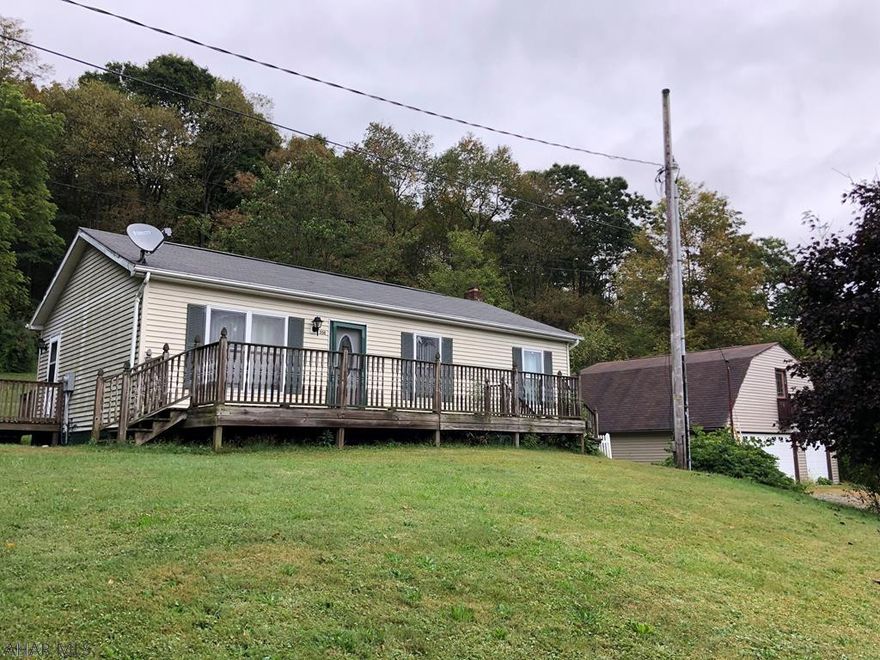 Enjoy the outdoors while living in town on this dead end street.  Sitting on almost an acre, this 3 bedroom 1.5 bath home has newer furnace and hot water heater.  Entertain family and friends downstairs in this unique space.  Also features a large oversized 3 car garage to store all of your vehicles, convert the upstairs of the garage into additional family living space.  Natural gas tap is available if you would want to switch.  Don't miss your chance at this one. Call today!