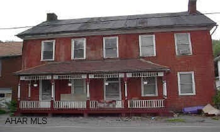 Historic brick can be torn down or extreme renovation.  Street at front and rear of property.  Good visability from Frankstown Road and Rt. 22.  Public sewer to be coming soon.  May have city water already.  Last used as a duplex. Built in the 1800's. LARGE LOT ZONED INDUSTRIAL (50X175). TEAR DOWN OR RESTORE HISTORIC BRICK ON LOT. GOOD VISABILITY. COULD BE ANYTHING FROM SINGLE FAMILY TO INDUSTRIAL. OWNER MAY CONSIDER FINANCING. CALL DARLA 946-4343 X121. MAKE AN OFFER.