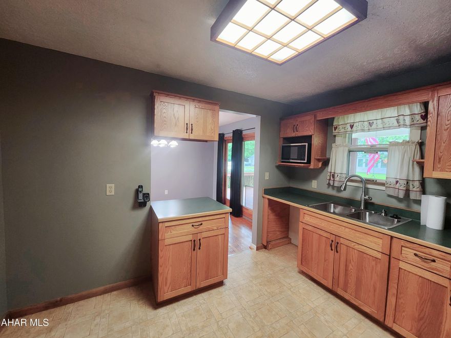 Charming 3-bedroom home on a flat lot, at the end of the cul-de-sac in Spring Cove School District. This home offers an open kitchen, living room, dining room, and back deck area perfect for entertaining. The main level also offers a pantry closet, a full bathroom, and 3 bedrooms. The primary bedroom has a large closet and half bath. The lower level offers a bonus room with a vented wood burner and an integral garage. The outdoor space is wonderful with a large deck, apple trees, a fire pit and an area previously used for an above-ground pool. Call listing agent for your private tour.