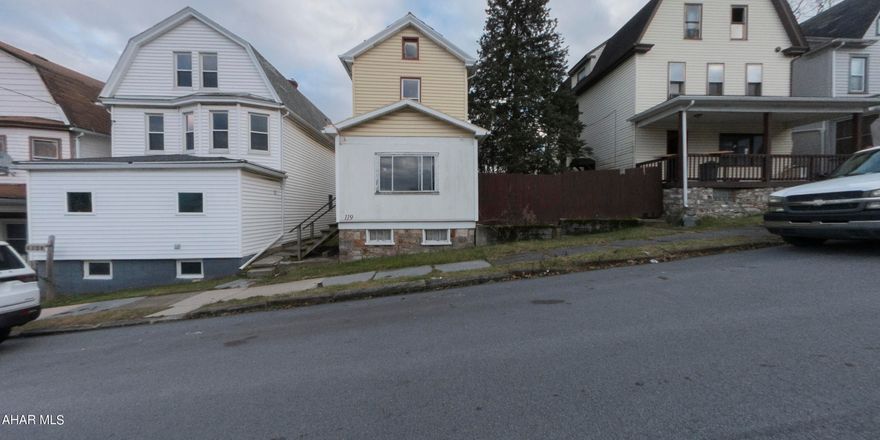 Welcome to 119 Bell Avenue, Altoona, PA - a charming two-bedroom, one-bathroom home brimming with potential and awaiting your personal touch. Priced at $29,900, this property is an exceptional opportunity for owner-occupants to use renovation financing to transform it into their dream home. As you enter, you'll find a cozy living room with a ceiling fan and a large window that bathes the space in natural light. The dining room, featuring a wooden floor and a classic staircase leading to the second floor, exudes potential for elegant dinner parties and gatherings. The door in the dining room provides convenient access to the basement. The kitchen, adorned with retro-style metal cabinets and a ceiling fan, is a canvas for your culinary dreams. Though the kitchen floor needs replacement, the adjacent laundry room with a door to the rear yard adds practicality to the space. Upstairs, the two bedrooms offer comfortable personal retreats. Bedroom 1 features built-in shelves, perfect for displaying your favorite items, while Bedroom 2 includes a closet for storage. The bathroom, with a shower over the tub, awaits your revitalizing touch. The unfinished basement, accessible through a door to the side yard, houses the gas hot air furnace, hot water heater, and electrical panel. A bonus toilet in the basement adds convenience. Outside, the one-car garage, though in need of work, provides valuable off-street parking. The property's exterior and structure, although in need of major repairs, present a unique chance to revive its charm and character. This home is not just a house but a project of passion for those who see beauty in restoration. During the first 20 days of listing, only owner-occupant offers will be considered, ensuring you have the opportunity to explore renovation financing options without competition from investors. No offers accepted in first 7 days of listing. Seize this chance to make 119 Bell Avenue your own. Imagine the possibilities, embrace the journey of transformation, and create a home that reflects your style and dreams.