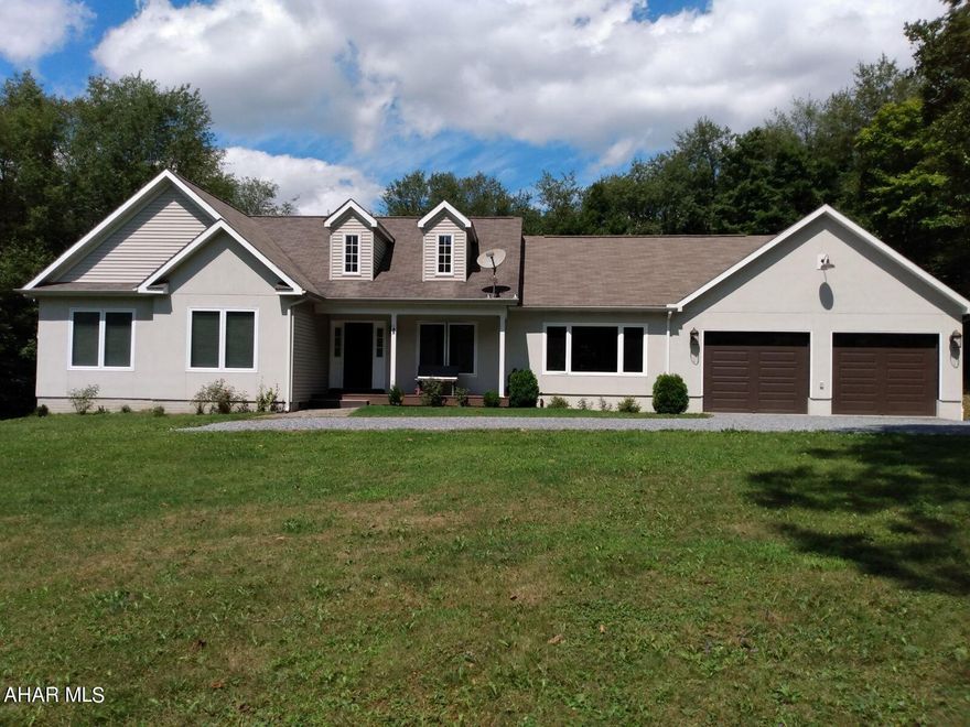 Acreage, privacy and wildlife... this beautiful home has it all. Nestled on nearly 6 acres, this 3 bedroom, 2.5 bath home boasts many amenities. As you enter the home, there is a large tiled foyer. the 16x33 great room has vaulted ceilings, heated floor with thermostat, a pellet stove and large windows to enjoy the views. The kitchen overlooks a large dining area and vaulted living room. the primary bedroom has a walk-in closet with full bath. 2 bedrooms, full bath, laundry and 1/2 bath complete the 1st floor. The basement is finished with a lovely tile flooring for even more bonus room! Enjoy the outdoors and cookouts on your deck. Relax in the 8 person hot tub with nothing but peace and quiet. The attached garage is 24x38 and will fit 3 cars. The floor is heated with thermostat. Additional garage door in rear. Partial property across from house is owned by seller.