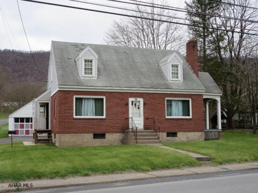 Nice brick 3 bedroom Cape Cod. Located on edge of Everett Borough close to downtown. Hardwood floors throughout. Public water and sewer. Two car detached garage.