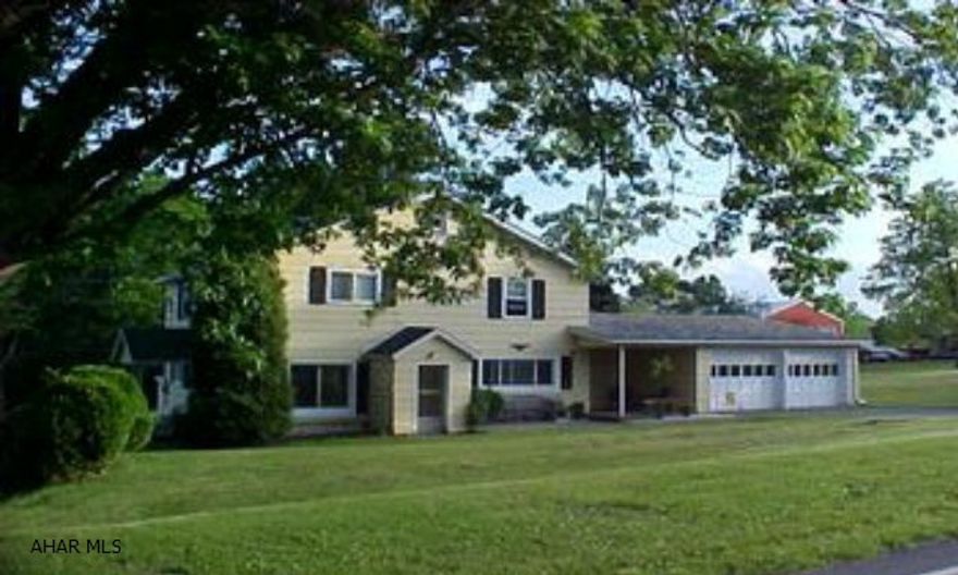 Hollidaysburg Schools! Great setting with 1.92 acres, beautiful oak kitchen, hardwood floor in formal dining room, den with fireplce, 1st floor laundry, 2 car garage, and new metal roof on house. J-052