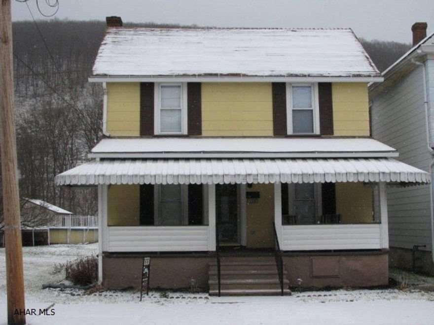 Tyrone charmer on a quiet street close to shopping! 2 1/2 story home with nice LR., EIK., 1st floor family room, full bath on each floor, 3 bedrooms, nicely updated, choice of heating with natural gas,coal,or wood hot water heating! Low taxes and priced to sell @ $72900