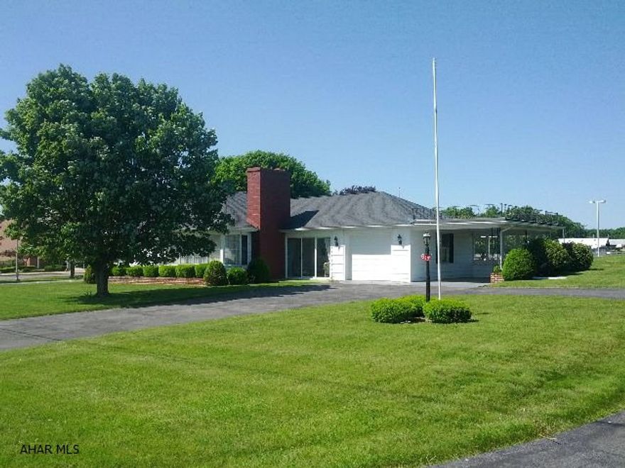 Nice 1-story home with attached garage & carport, central air, sunroom, updated kitchen & bath, and livingroom with fireplace. #J-137