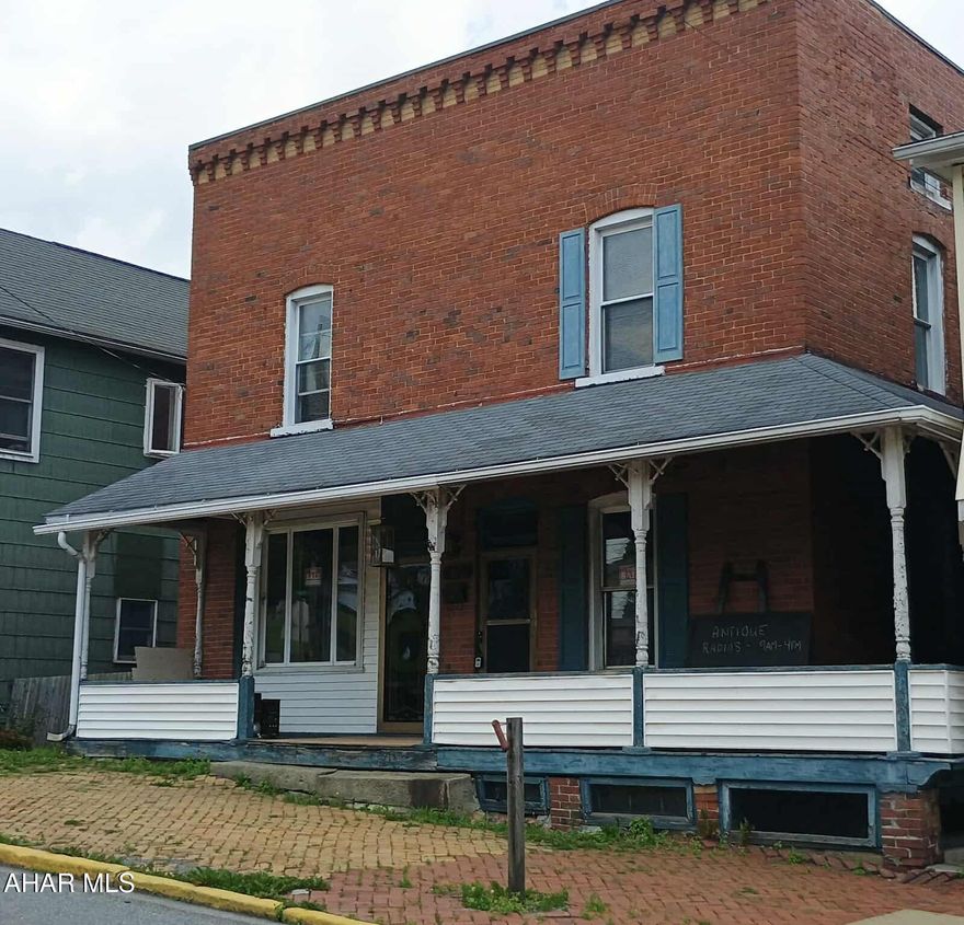 Versatile 3-Bedroom Home with 2 Kitchens, Large Basement & 3-Car Garage - Potential Duplex!  Discover the charm and endless potential of this spacious 3-bedroom, 1.5-bath home, perfect for residential living or investment opportunities. Nestled on a generous lot with a large yard and wrap-around covered porch, this property offers comfort, character, and flexibility.

Step inside to find original hardwood floors that bring warmth and timeless style to the main living areas. The unique layout includes two full kitchens—one upstairs and one downstairs—making it easy to convert into a duplex.  The 2 first floor bonus rooms would make a great home office or store front. Character throughout this home featuring beautiful built-in cabinets and clawfoot tub.

A large basement offers abundant storage.  Outside, the heated 3-car garage provides ample parking, workshop, studio or business potential, or space for all your toys.

Located in a quiet, established neighborhood close to schools, parks, and shopping, this home offers both immediate livability and future investment potential.

📞 Call today to schedule your private showing!