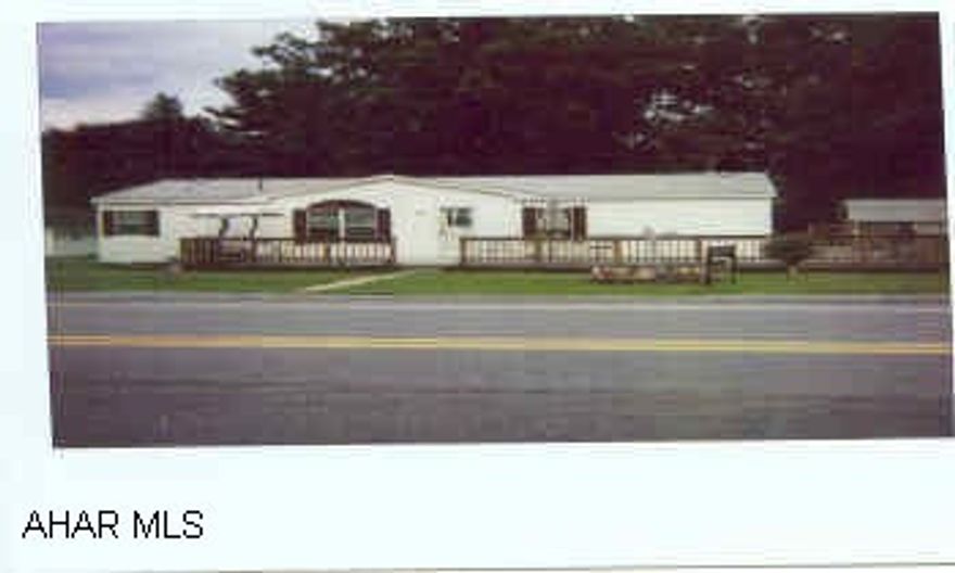 2001 Fleetwood Double wide - wrap around deck, garden tub. Extra building on lot could be garage.