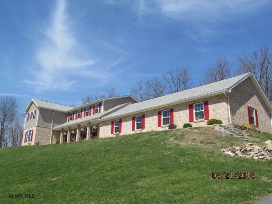 Custom built in 2004, this spacious 4BR, 3.5 bath is immaculate, privately sitting on 2.41 acres. Energy efficient features include radiant floor heat, humidity control system, C/A, reverse osmosis water system, & LED recessed lighting throughout. Large eat-in kitchen with granite countertops, center island and desk area opens into the large & inviting family room.  Partially finished basement includes a full bath.  Don't forget the 4-car heated garage!  You can't build a home of this quality for this price.  Located within minutes to UPMC Altoona and Campus.