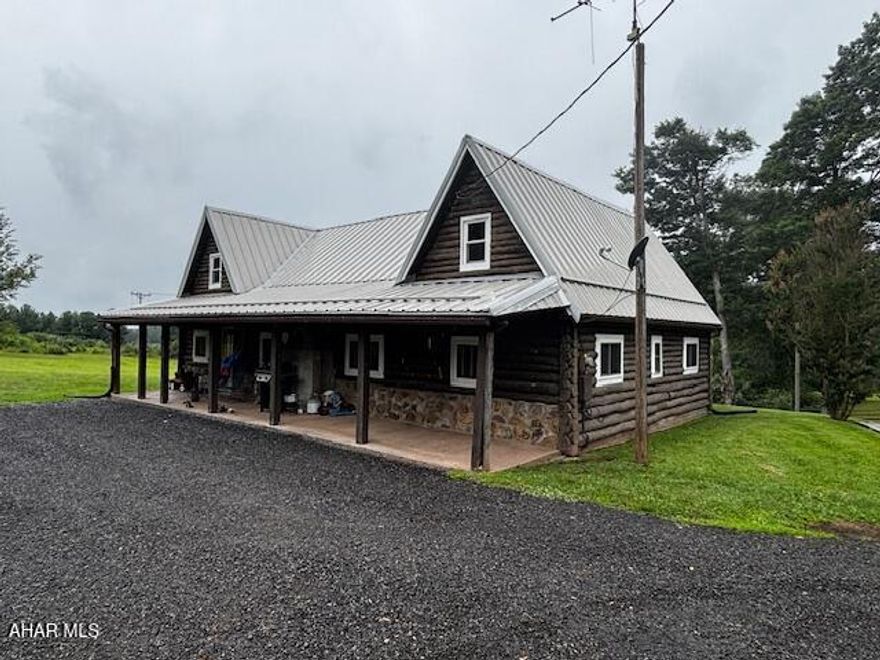 This log home, set on 5 private acres, offers a peaceful retreat for nature lovers and outdoor enthusiasts. Located within a mile of Pennsylvania State Game Lands, this property is perfect for hunting, hiking, and exploring the great outdoors. The home features 2 cozy bedrooms and 1 full bath, providing a comfortable living space with room to grow. A new roof was installed in 2022, ensuring peace of mind for years to come. The outdoor wood stove, with a backup oil heating system, adds both warmth and efficiency to the home. The property offers incredible potential, with the option to finish the second floor for additional living space, whether it's for extra bedrooms, a home office, or a recreational area. The land provides ample opportunity to make it your own, whether that means creating a garden, building a workshop, or simply enjoying the serene surroundings. With its tranquil setting and close proximity to outdoor activities, this home is the perfect getaway or full-time residence for those looking for a seclusive retreat.