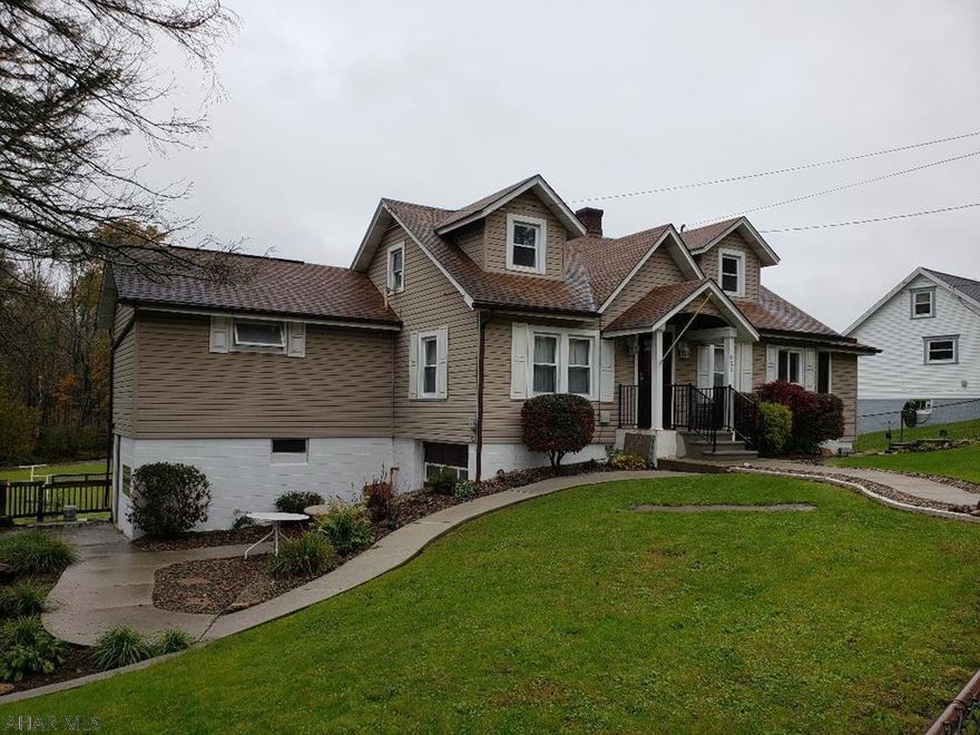 Nice 3-bedroom 2-bath vinyl-sided home w/Master Bedroom suite upstairs, formal Dining room w/built-in corner cupboard, outbuilding with screened-in enclosed patio, covered pavilion, above-ground pool & fenced yard.  Nice peaceful back yard borders stream. J-457