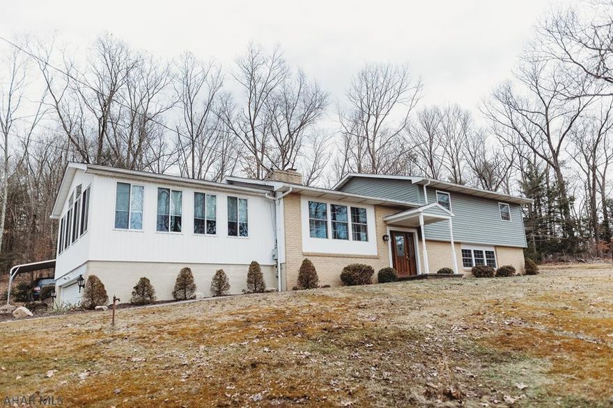 Just look at this STUNNING split level, 4BR, 2BA home! Spacious living room with high ceilings. A gas-fired fireplace between the kitchen and the dining room. This home features ceramic tile, carpet and hardwood flooring throughout. Beautiful patio, attached garage and a shed for extra storage. This home is a MUST SEE!