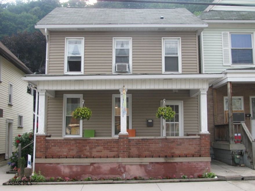 2 1/2 story vinyl sided Tyrone home with lots of updates! This home offers LR., DR., kitchen, 1st floor laundry & powder room, 3 bedrooms, & renovated full bath! Covered porch, fenced yard and off street parking complete the picture!