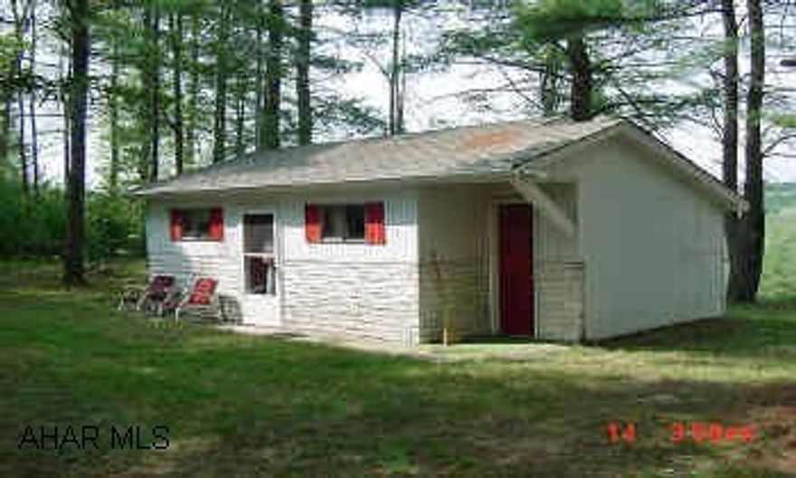 Great weekend getaway or hunting camp with a great view! Short drive to Rock Run Recreation center, large tracts of state game lands nearby. Within a mile is  Prince Gallitzin State Park. 14 x 14 shed included. From Altoona, Rt 36 to Ashville, turn right on Rt 53 towards Coalport, turn left @ Sir Barney's Restaurant, turn right onto Church Hill Road.