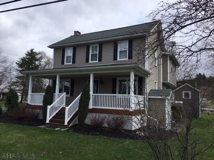 Absolutely charming 1860's remodeled country home with an excellent location and a picturesque yard! Move-in ready is hard to find as is a home with such quality throughout. Custom made hickory cabinetry in the large eat-in kitchen plus a breakfast bar and wood floor! Kitchen is wood-stove ready. Enjoy the convenience of first floor laundry and full bath. Kitchen is open to the living and dining rooms. Cathedral ceiling, private balcony, walk-in closet and attached full bath complement the spacious master bedroom. The original summer kitchen is present. Extended 4 car garage with a covered patio offers outdoor living space as does the covered front porch and side deck. Solid six panel wood doors, brushed copper hardware, zoned heating, central air and additional outbuildings.