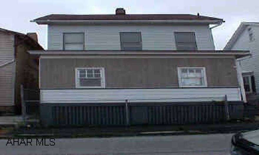 Needs some minor clean up, fix up - NOT BAD!  Aluminum sided newer roof some up dates.  Good Investment Property..... Electricity and Gas have been turned off please take flash light to look at basement.  Parking Pad in  rear, fenced yard enclosed Sun Room - not sure if electric service is breaker or fuse.  Aluminum siding newer roof updated Kitchen 1st floor laundry & full bath - Borth baths updated.