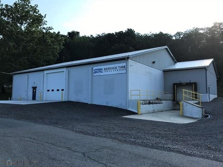 One-story masonry & frame building containing 7,240 S.F. Ceiling heights range from 12' to 15' , two overhead drive through doors and one loading dock. 200-amp electric, natural gas, public water & public sewer.  Building is well maintained and many recent updates were just completed. Great for warehousing, retail business, mixed-use property or vehicle storage. Located in Bedford township (no zoning) just outside the Bedford Borough and downtown area. Lease option available.
