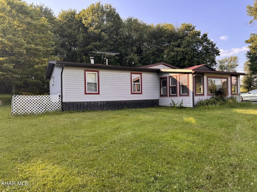 Central Cambria schools- doublewide with land.  3 Bedroom, 2 bath remodeled doublewide with  Enclosed front porch.
