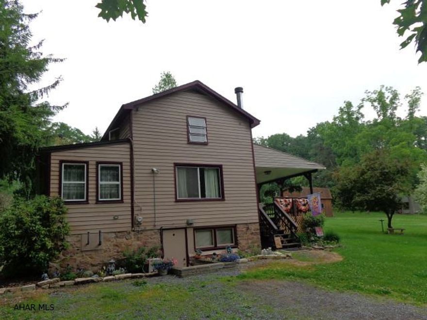 Cute house in SInking Valley on 1.9 acres, newer windows and roof, furnace.