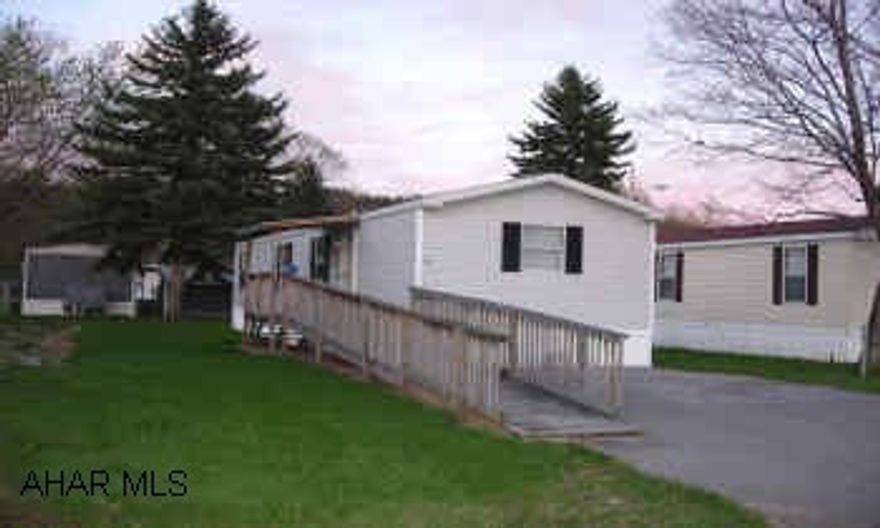 LIKE NEW HOME WITH HANDICAP RAMP.