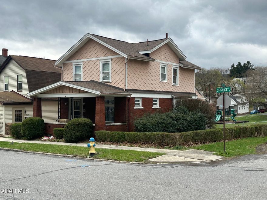 Charming home with original woodwork and built-ins on double corner lot.   First floor features living room, dining room with window seat, Kitchen, half bath, and enclosed back porch.  Second floor has three nice size bedrooms and full bath.   Nice yard and detached one car garage.  With a little TLC, this home could be a stunner.