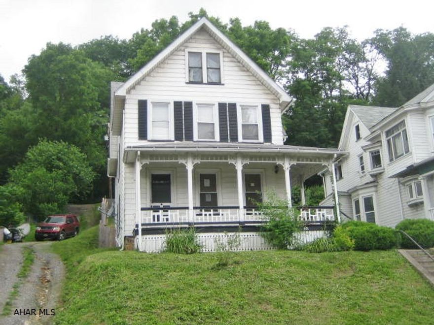 Large sized Tyrone 2 1/2 Story home with loads of potential. Needs some TLC, but could be nice with some work. Kitchen partially remodeled with newer cabinets, counters, floors plus laundry area. Large liviing room and formal dining room. Being sold AS-IS. Seller will make no repairs.