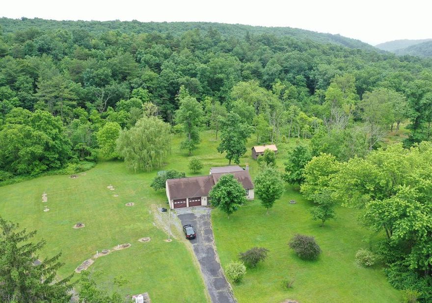 This 1.5 story home is situated on approx 3.55 acres!!!  The home has a total of 3 bedrooms and 2 full baths.  2 bedrooms and 1 full bath on the second floor and 1 bedroom and 1 full bath on the 1st floor.  The home also has an attached 2 car garage and large shed as well.