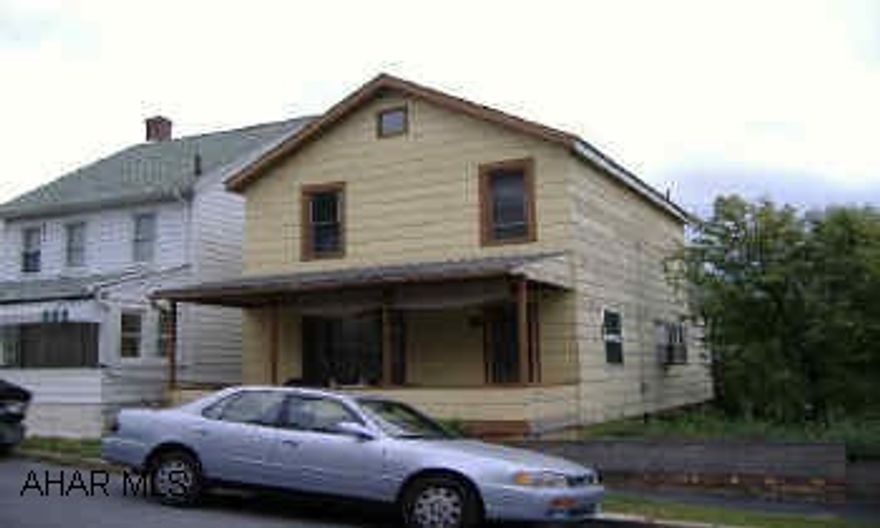 Good investment or starter. Needs work. Some newer windows, off street parking.