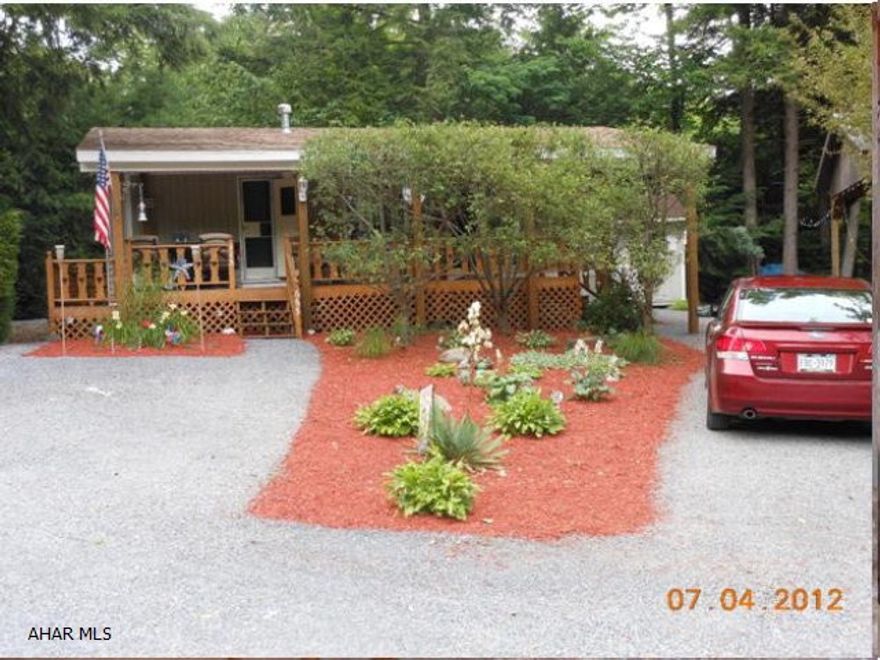 Attractive, well maintained Park Model. 3 BR, 1 bath, covered porch, rear deck, central air, fully furnished, deck & porch furniture & gas grill