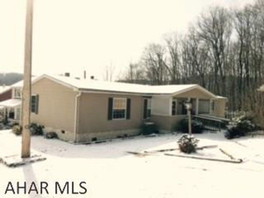 Exceptional 3 Br  double wide on double lot, garage carport, covered front porch and covered back deck. Beautiful fireplace in family room. All new flooring, french doors to rear deck.   Immaculate throughout