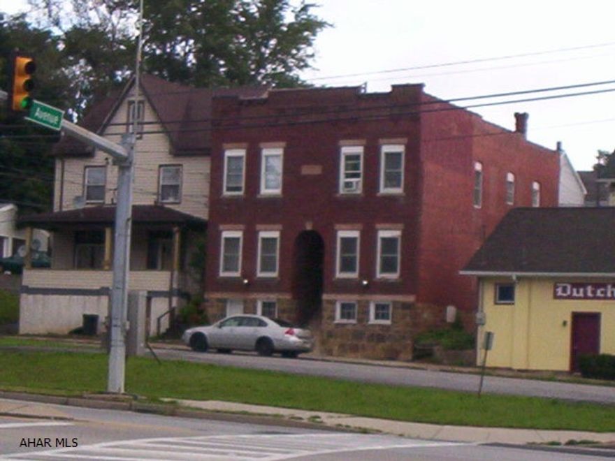 Four 1 bedroom apartments.  Tenants pay heat and electric.  Nice condition.