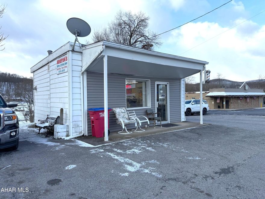 Position your business for success in this highly visible Main Street location!! This one-story retail building offers approximately 440 square feet of efficient, easy-to-manage space--perfect for a barber shop (existing use), bakery, deli, pizza/sub shop, coffee shop, office, or specialty shop. Situated on a .16-acre lot, the property features paved parking for customers and staff, along with a welcoming covered front porch. Inside, you'll find a mostly open layout, a small storage and mechanical room, and a half bathroom. Equipped with a mini-split heat pump system (heating & air conditioning), plus a kerosene forced-air heater for supplemental heat, 100-amp electrical service, and an electric water heater. Whether you're launching a new venture or expanding your footprint, this affordable and well-located property offers great exposure and flexibility in the heart of the Saxton Borough.