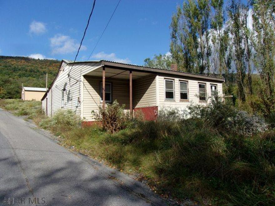 Great Investment!!! This property is rough & needs much rehab but has the potential to be a money maker. Lg. garage has lots of storage space or could be rented out.
