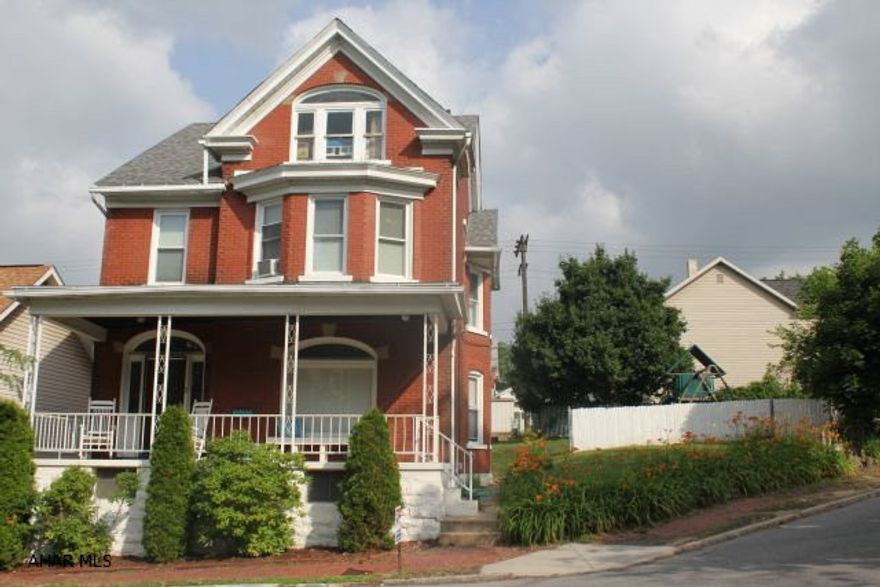 Neat looking 2.5 story book, updated windows & furnace, well maintained, brand new 40 year roof, hardwood floors, cool looking interior, interior retro decor, spacious layout. Nice back yard, extra side yard. Must See!