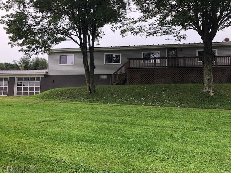 Manufactured 3 Bedroom 2 Bath with new metal roof, new siding, new exterior doors on 3.72 acres.  2 car garage attached.  24x56 barn with stable dividers in place for horses.  Barn has electric and water.  Furnace is 2 years old.  Full basment unfinished.  Easement on North side of property to 40 acre neighboring property.