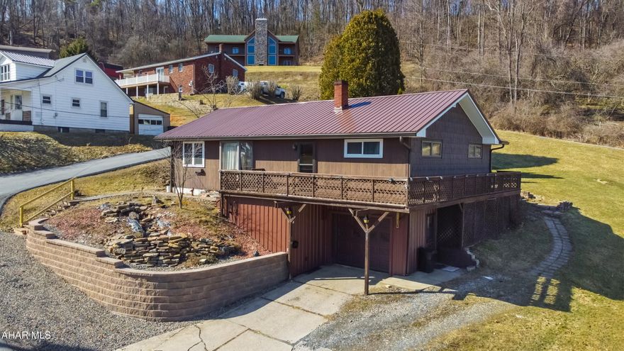 Welcome to 209 Hickory Street, a stunning ranch-style home located on a generous corner lot on the outskirts of Northern Cambria. This beautiful residence has recently undergone breathtaking updates designed to enhance both comfort & convenience. Upon entering the main floor, you are warmly welcomed into a spacious living area filled w/ natural light, thanks to large bay windows. The inviting dining area effortlessly connects to a fully remodeled kitchen that boasts custom oak cabinets, exquisite quartz countertops, a large island, & soft-close drawers, among other exceptional features. The upstairs level offers two generously sized bedrooms & a full bathroom, with hardwood floors hidden beneath the carpet throughout the entire area, ready to be revealed. The nearly finished basement provides an additional living area & includes two versatile rooms, ideal for extra bedrooms or office space. This level also features a 3/4 bathroom, laundry area, & a utility room. Plus, you'll enjoy easy access to your integral heated garage from the basement. Stepping outside, you'll be impressed by the home's exterior, which includes a durable metal roof, a new retaining wall, leaf guard gutters, a charming wrap-around porch, & a spacious yard. Additional outdoor highlights include a gazebo & a lovely paver patio, adding to the overall appeal. Call today!