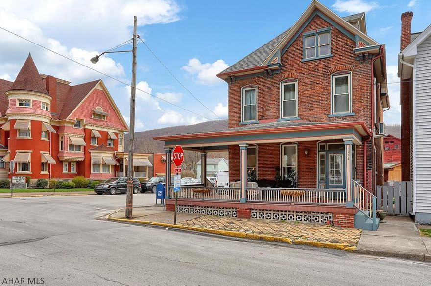 Looking for a home to live in and give you INCOME POTENTIAL? You will love this stunning 3-story Tyrone home with-in walking distance to amenities.  This home is a low maintenance home that at one time the home was two units and could easily be converted for extra income.  All the furnishings in home are negotiable. This 4-5 bedroom has plenty of space, giving you 3600 square feet of charm only an old house can offer. With the original hardwood floors throughout, built-in cabinets, extravagant gas fireplace, 10-foot ceilings, and spacious porches you will feel at home.  The home has maintained its original elegance, while having modern upgrades including central cooling and energy efficient heating system, even heating the bonus room on the third floor!  The home also has a security system