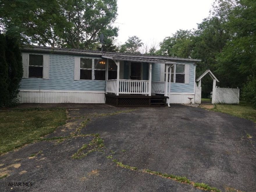 Very well maintained double wide in a quiet mobile home park. New flooring in Living room & kitchen. Master features walk in closet & jacuzzi tub. Covered porch, patio, shed & large driveway....perfect starter home.