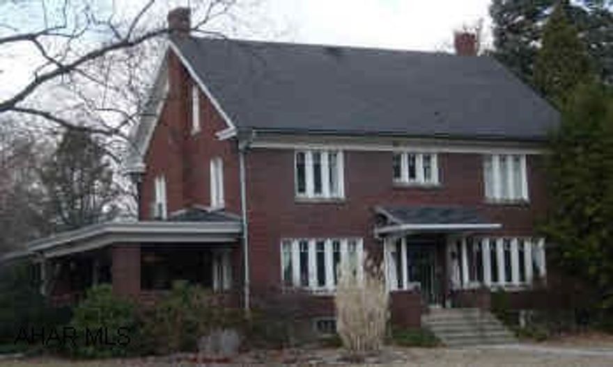 Large brick home, lots of charm & tastefully decorated. Hardwood floors, butlers pantry, large rooms, courtyard w/hot tub. Large lot.