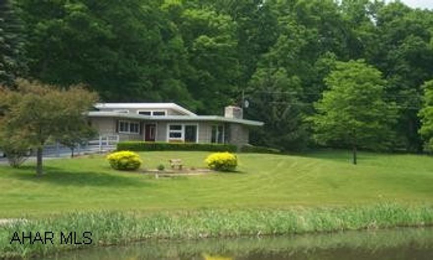 3 bedroom 2 bath home situated on 10.67 private acres with a pond, mostly wooded, and 2 car detached garage freshly painted inside and out , new flooring, and new bath facilities.